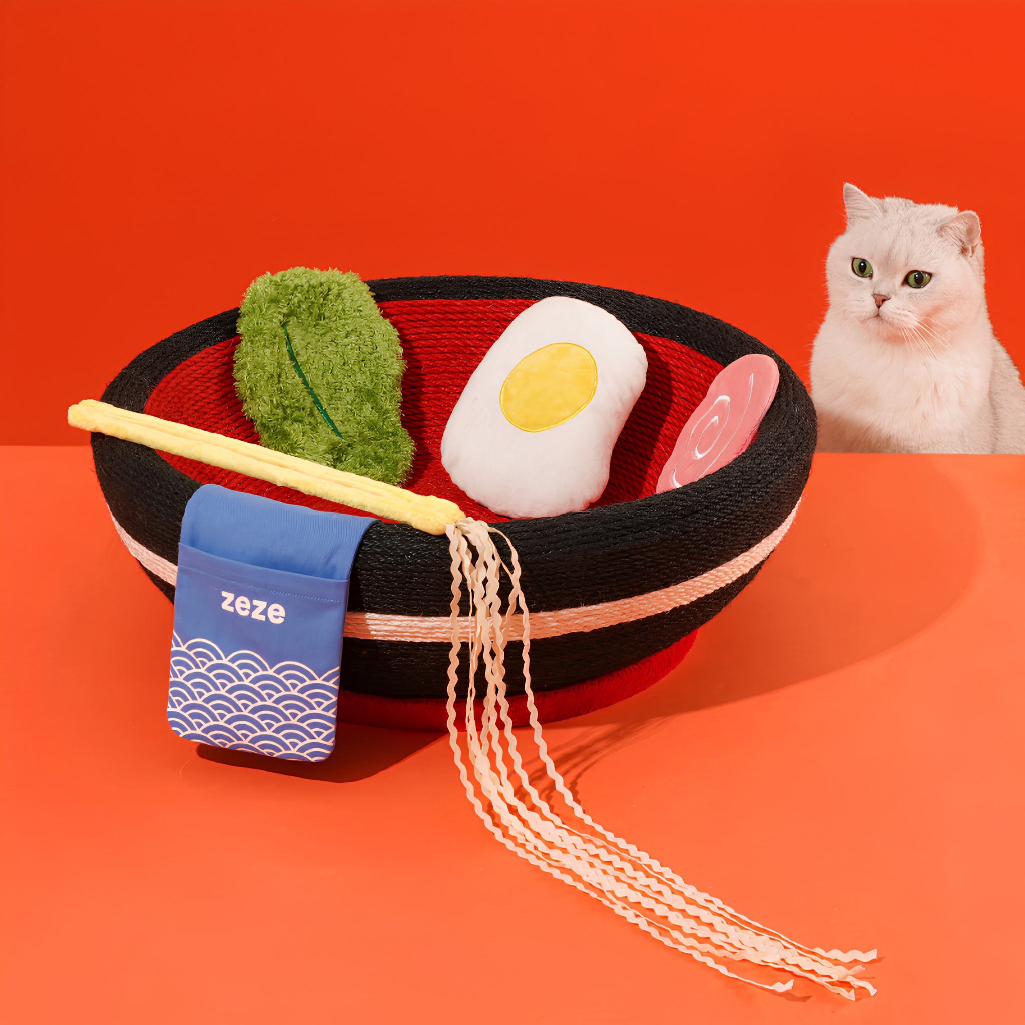 A cat inside a ramen-bowl-shaped sisal scratcher
