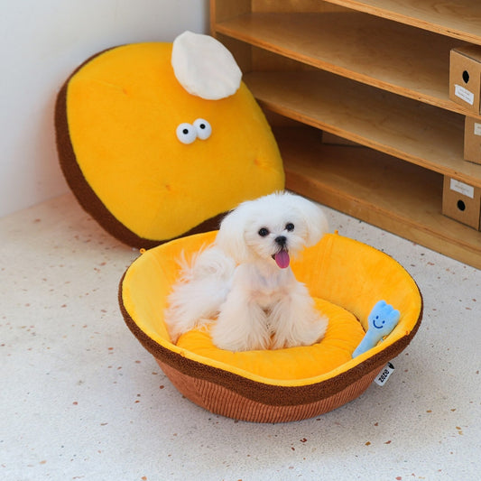 Dog in the open tart base with the lid off