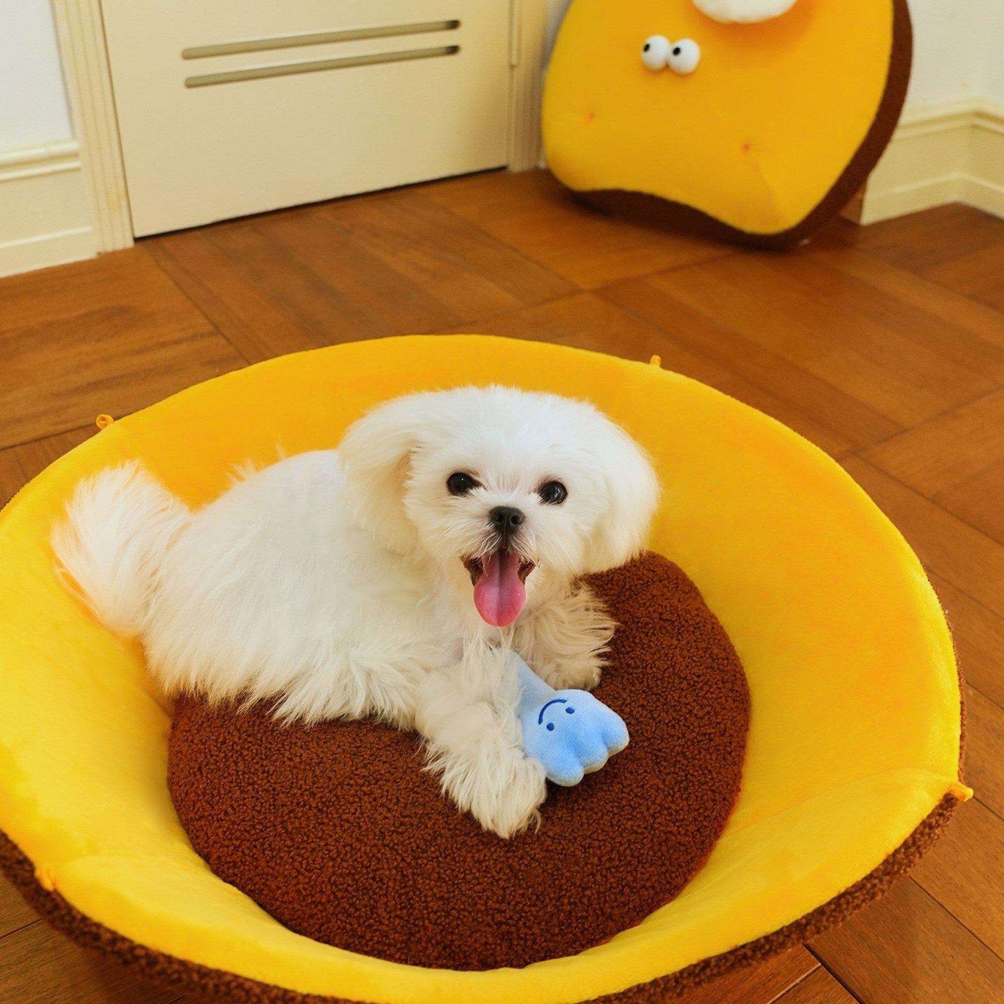 Dog on the tart base cushion with the fork plush