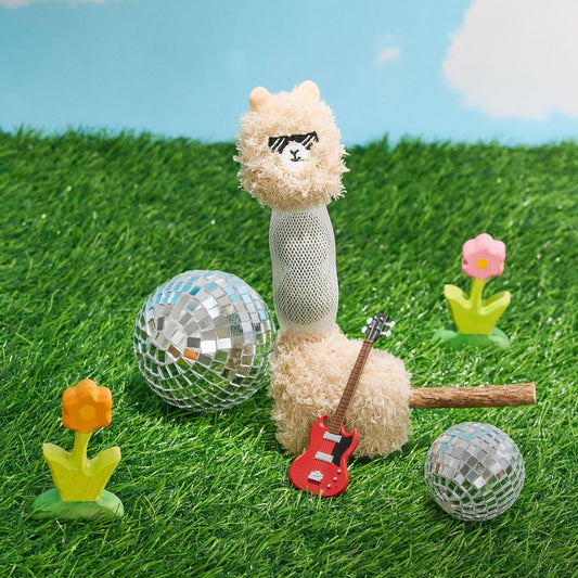 Alpaca cat toy on grass with a mini guitar and disco balls