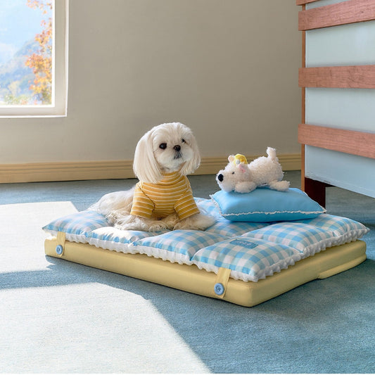 Small dog and plush puppy on the ZEZE gingham nap mat in a bright room