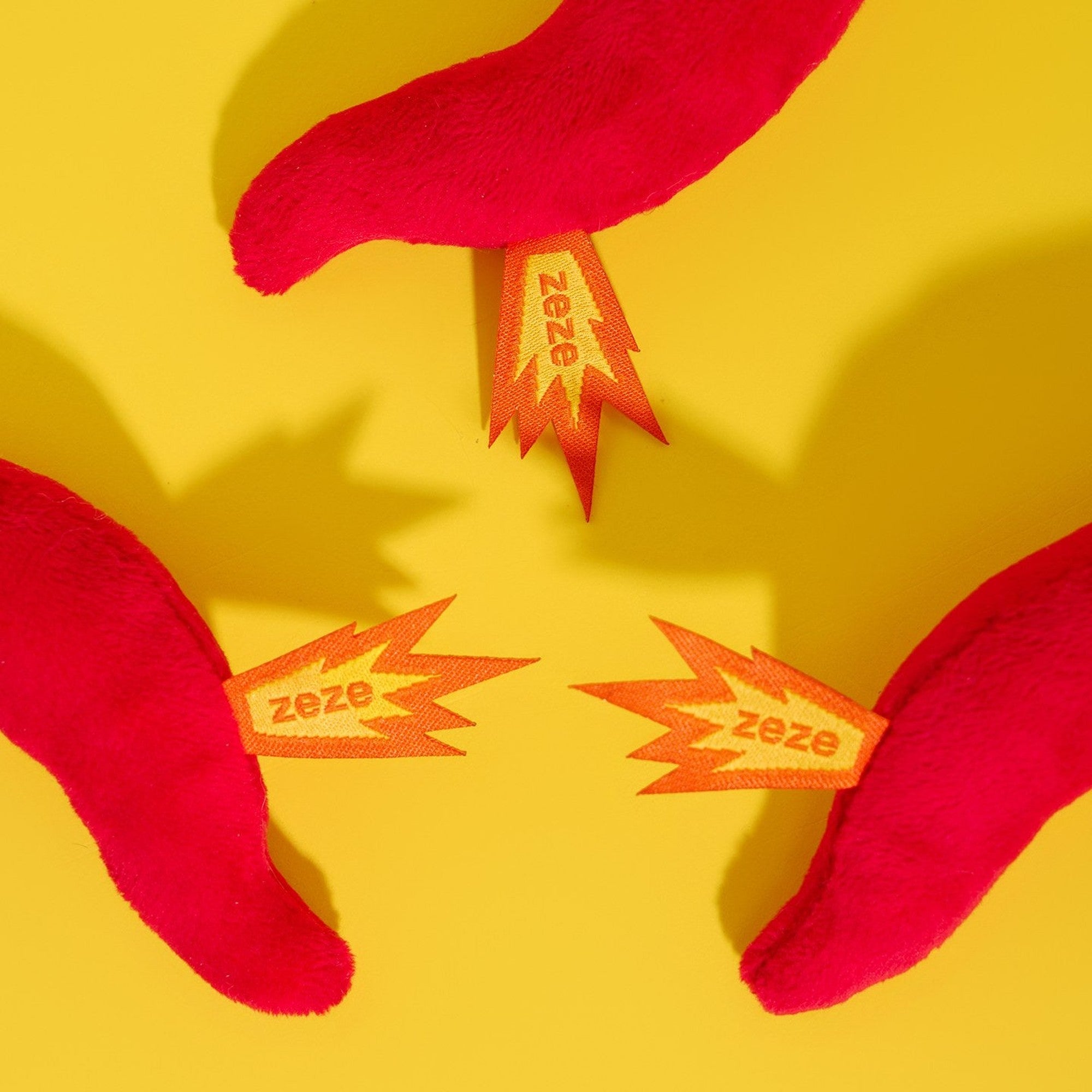 Close-up of the orange flame tags on the chili cat toy