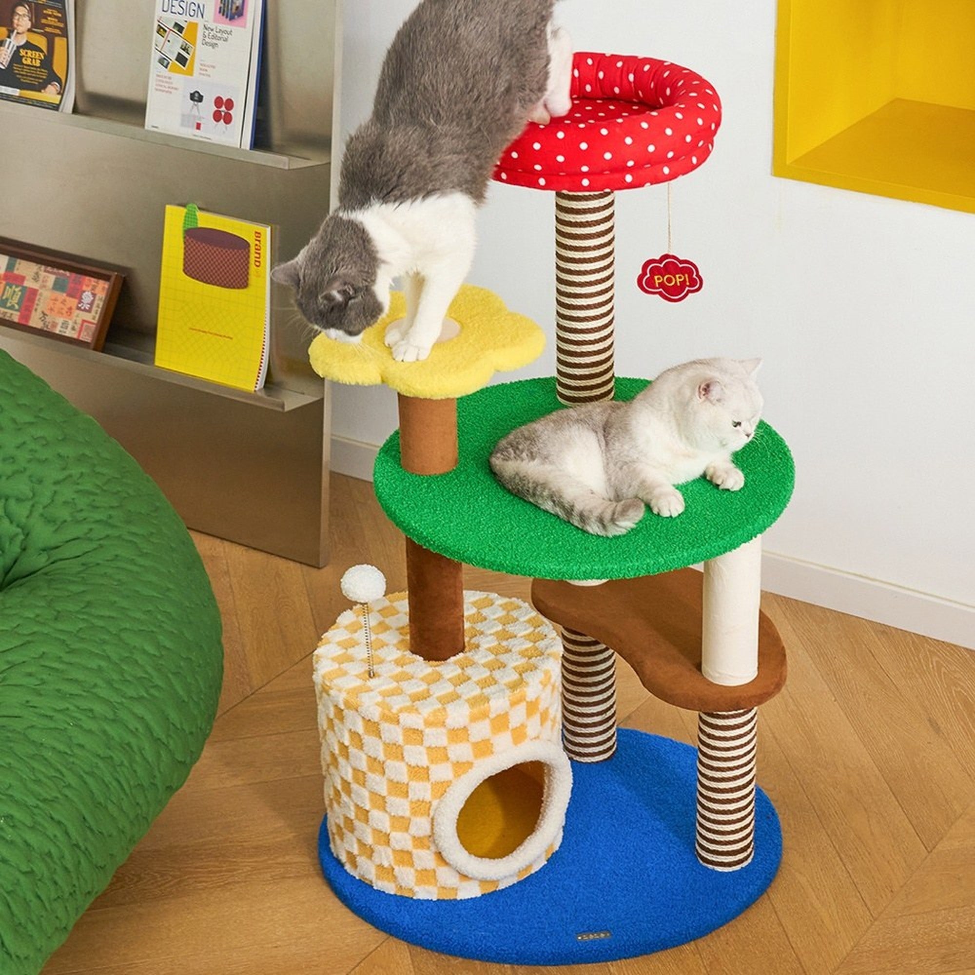 Two cats on the Magic Garden cat tree beside a bookshelf