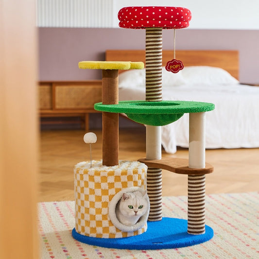 Magic Garden cat tree in a bedroom with a cat inside the checkered condo
