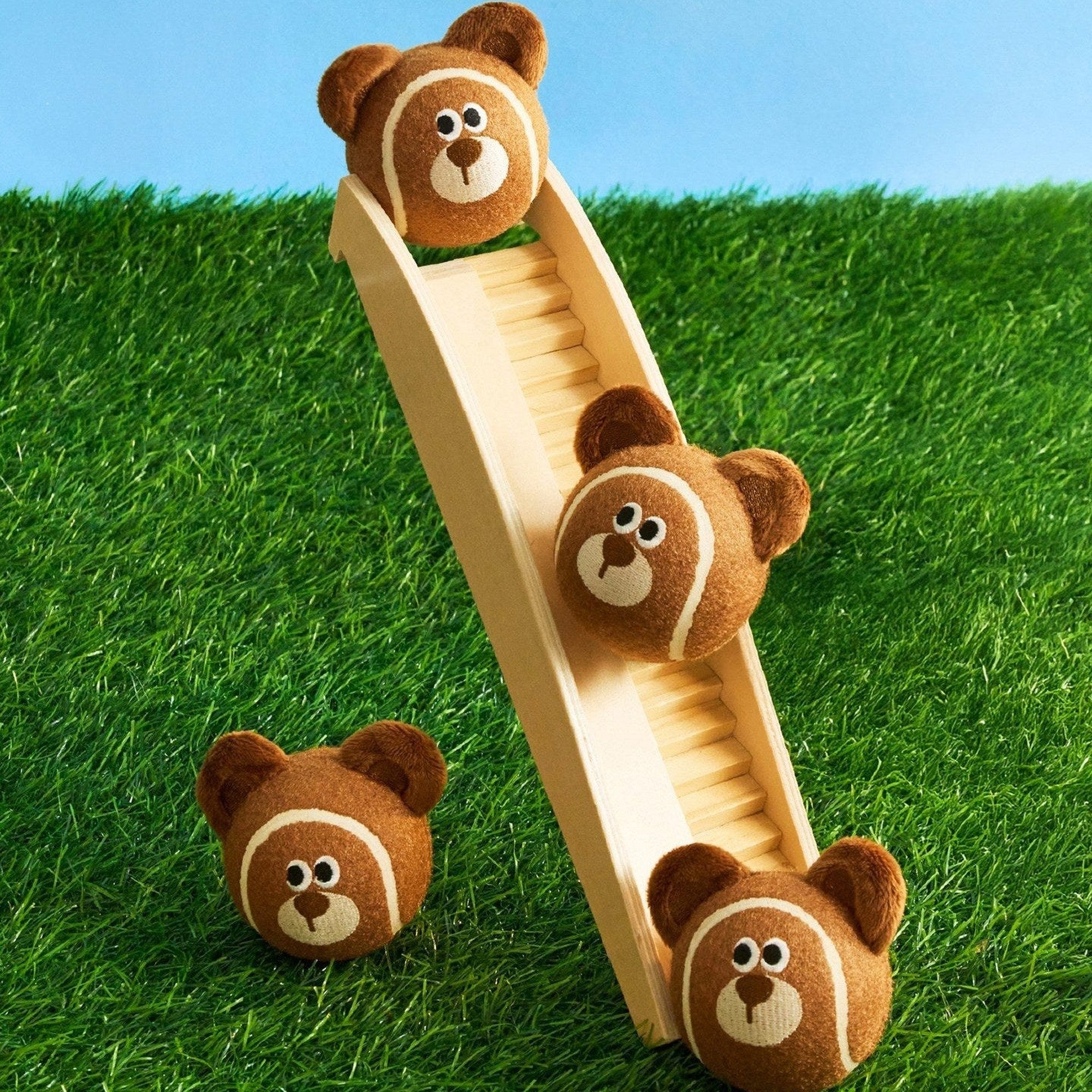 Mocha the Bear balls rolling down a toy slide