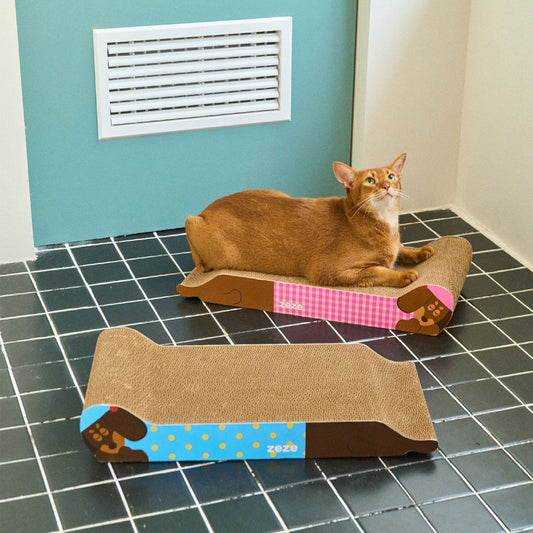 Cat lounging on the pink ZEZE Monica scratcher, blue piece in front