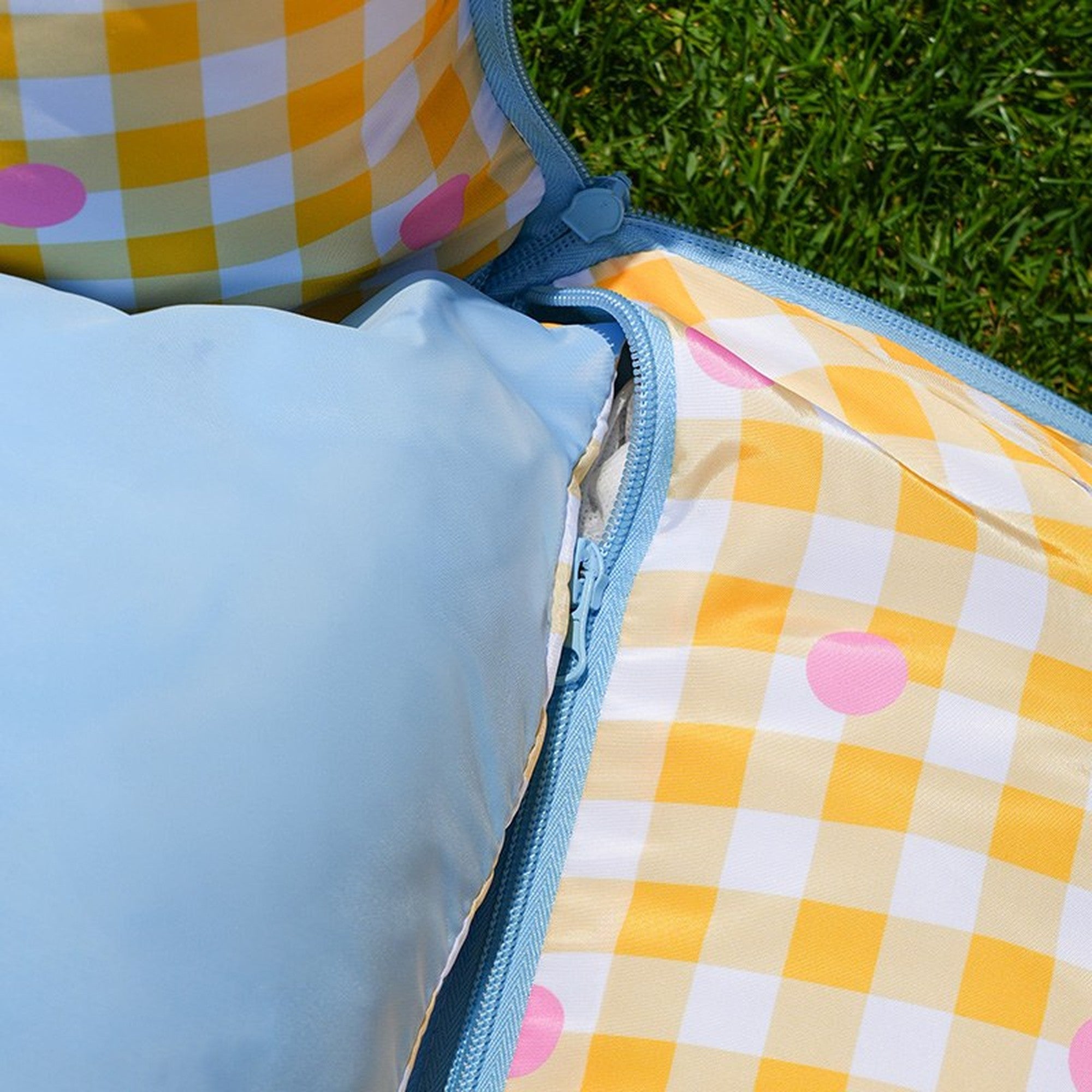 Zippered cushion detail in yellow gingham polka dot
