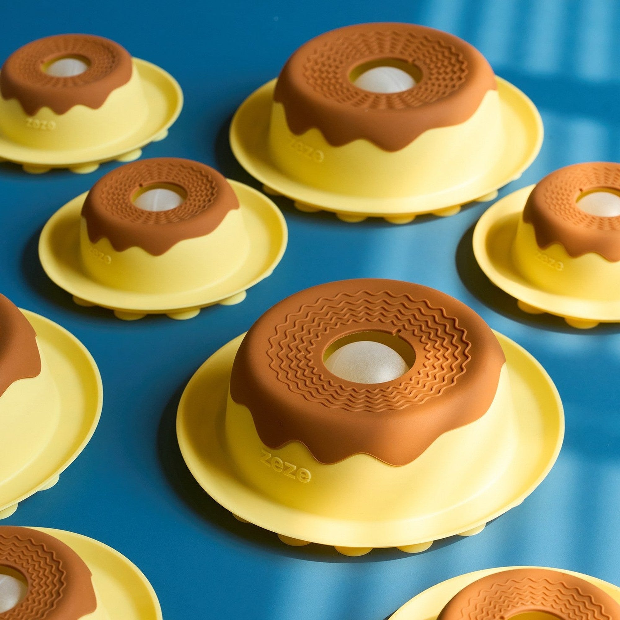 Pudding lick bowls on a blue table