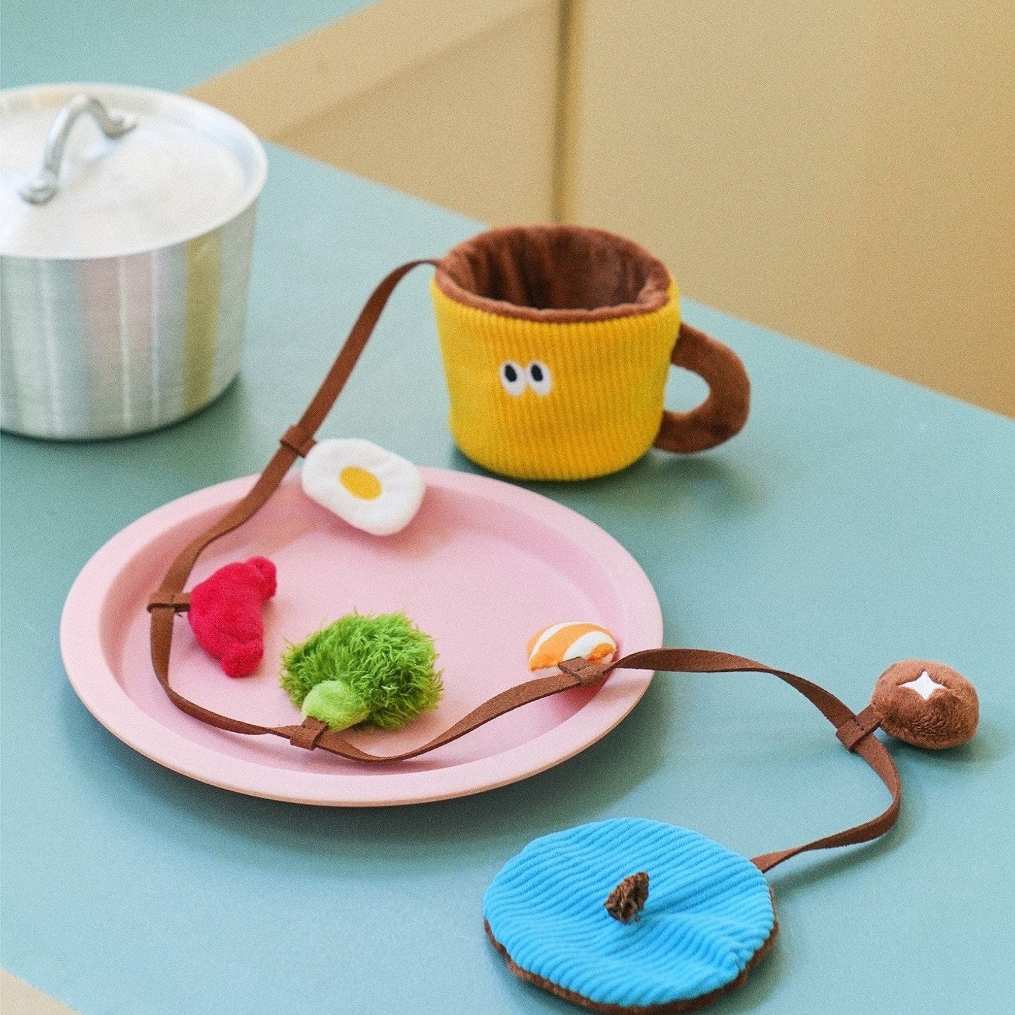 Snack Cup toy with charms on a pink plate