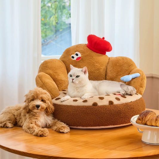 Dog and cat with the ZEZE Croissant pet sofa on a dining table